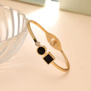 Geometric Black Enamel & Crystal Hinged Bangle – Gold Tone