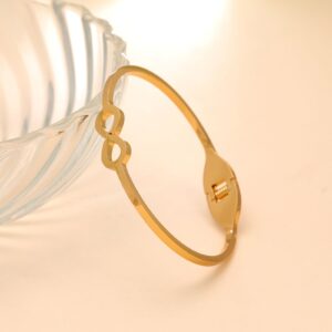Gold minimalist infinity cutout hinged bangle