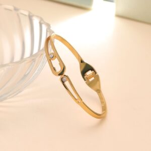 Dual Oval Cutout Crystal Hinged Bangle – Gold Tone