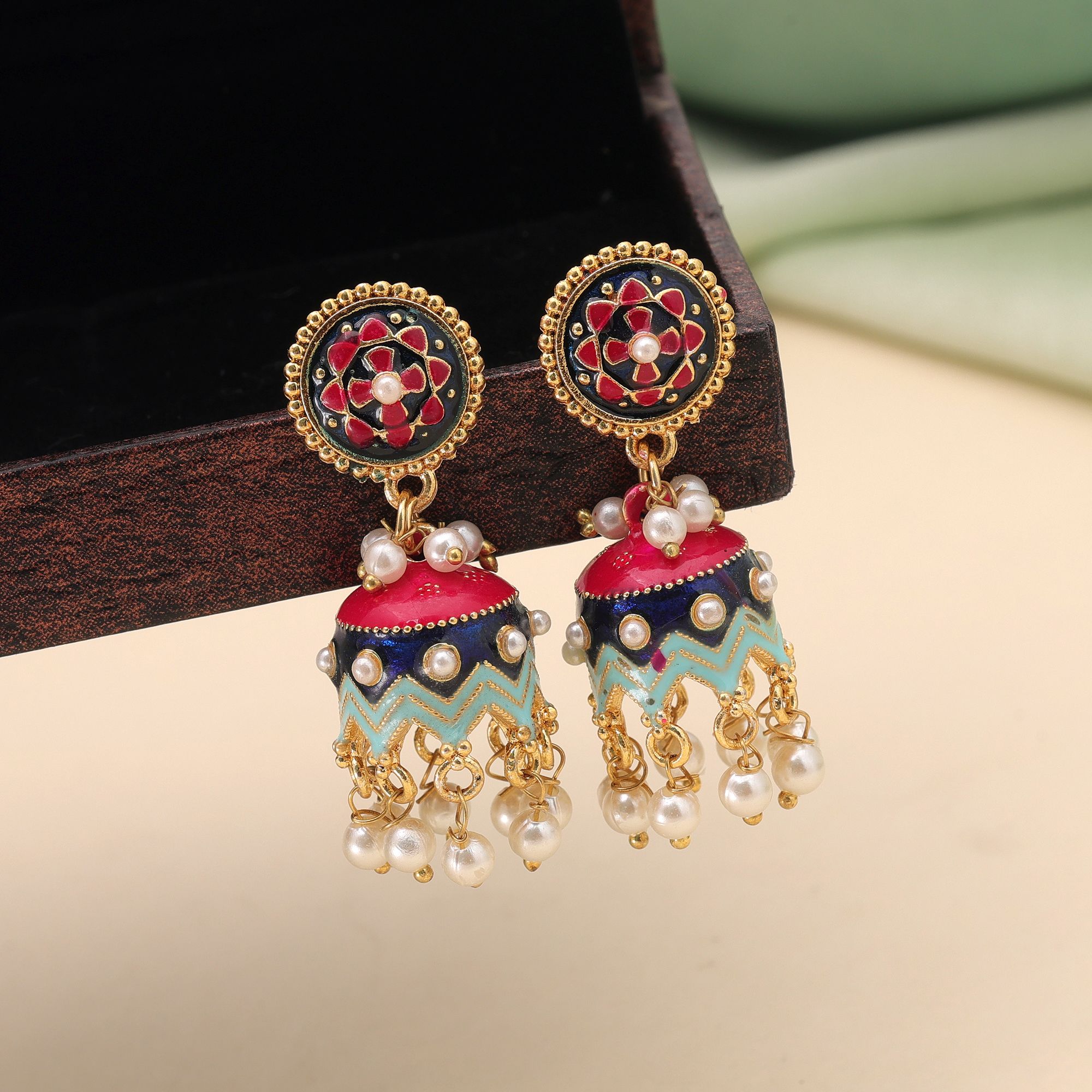 Traditional Indian Meenakari jhumka earrings with floral work and hanging faux pearls