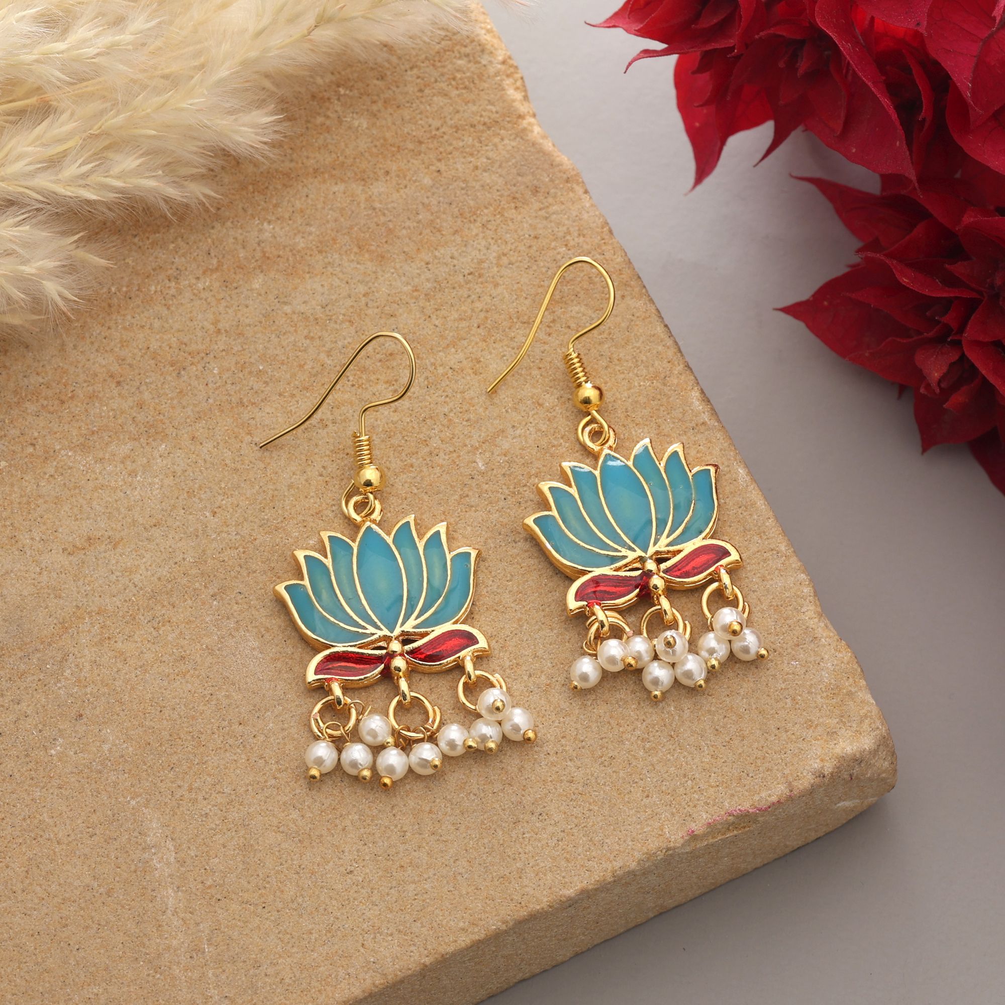 Handpainted lotus Meenakari dangle earrings with pearl drops on a gold-coloured fishhook.