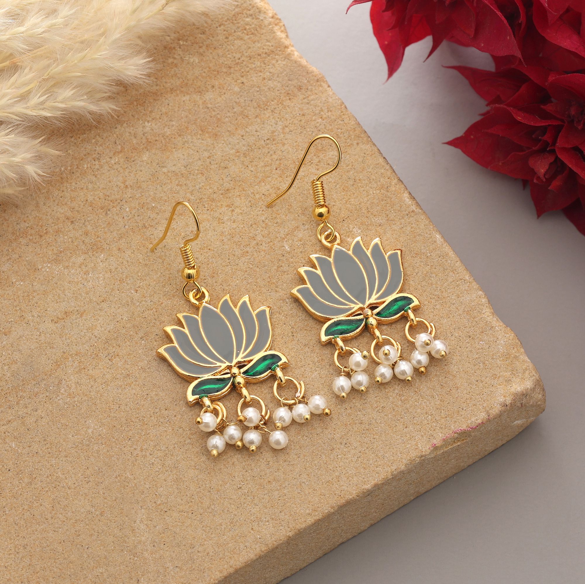 Handpainted lotus Meenakari dangle earrings with pearl drops on a gold-coloured fishhook.