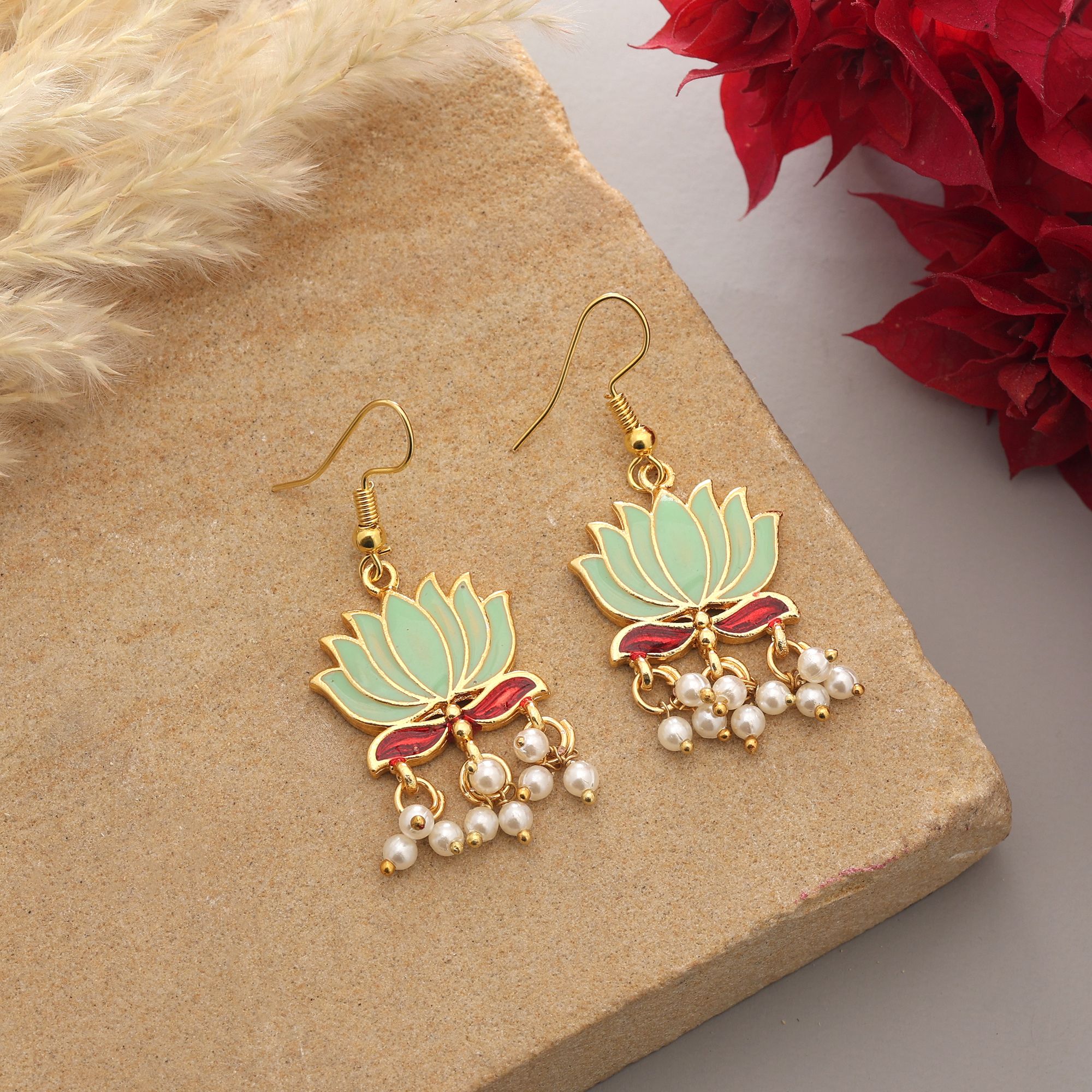 Handpainted lotus Meenakari dangle earrings with pearl drops on a gold-coloured fishhook.