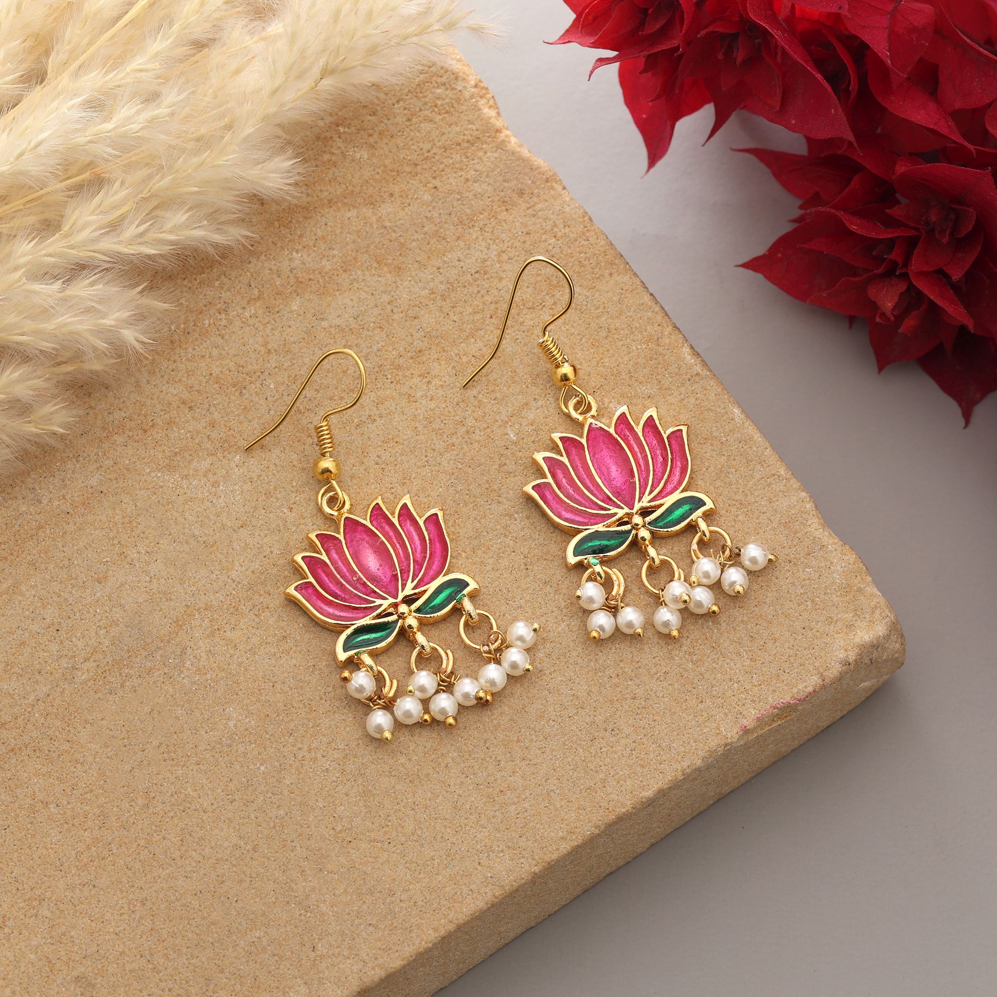 Handpainted lotus Meenakari dangle earrings with pearl drops on a gold-coloured fishhook.